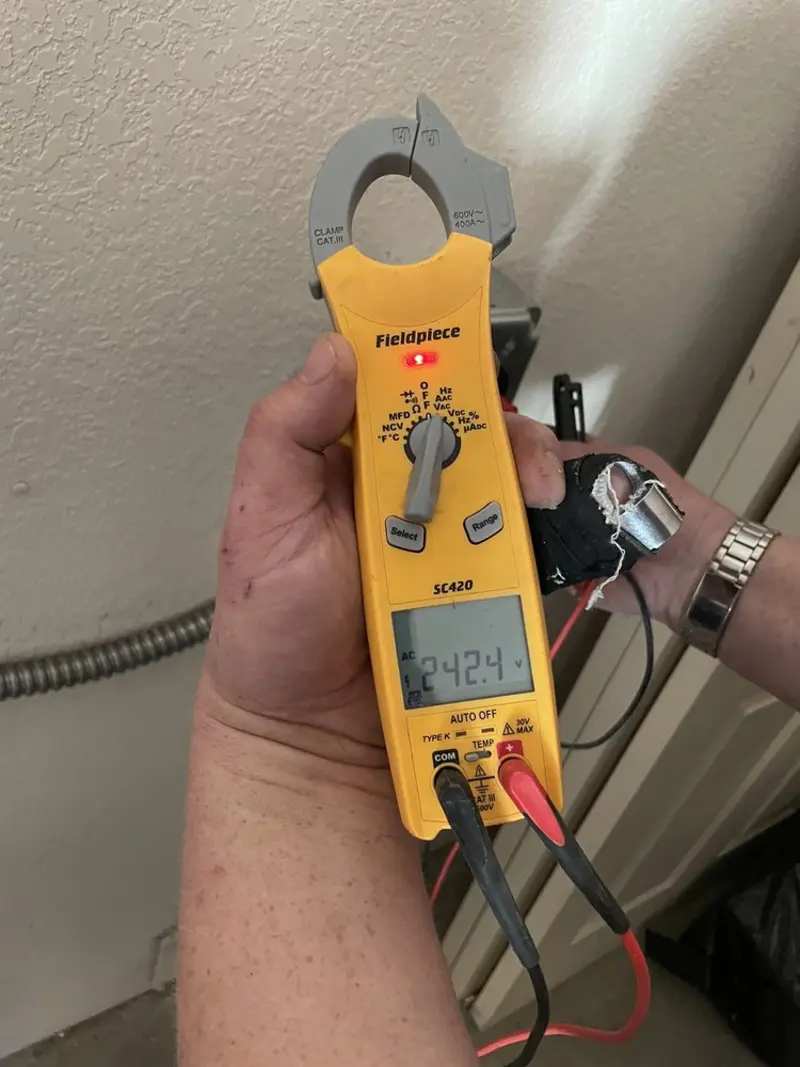Voltage testing with clamp meter during Hot Tub / Pool Electrical Wiring in Cushing